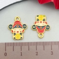 Detail view of colorful Chinese Fortune God charms with ruler showing 2cm height - Red Enamel Fortune God (18462)