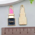 Detailed macro view of enamel lipstick charms with LOVE engraving and back texture - Rose Red Enamel Lipstick 29*11mm (22895)