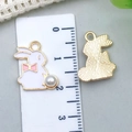 Macro view of pink enamel Easter rabbit pendant with white faux pearl and scale guide - 16*17mm / White Enamel Bunny (11940)