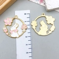 Detailed view of pink and white enamel bunny pendant with sunburst texture back - 31*30mm / White Enamel Bowknot Rabbit (23181)