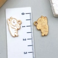 Detailed view of enamel rabbit pendant with dimensions shown on a metric ruler - 16*11mm / White Enamel Rabbit Large (23081)