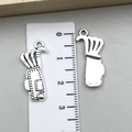 Detailed view of two golf bag metal pendants with ruler showing 2.8cm height dimension - Golf Bag Shape (22265) / Antique Silver