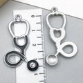 Silver stethoscope pendant with black enamel and rhinestone showing 4cm size measurement - Black Stethoscope (23222)