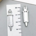 DIY syringe charm for jewelry making with white enamel finish and metal back - Small White Syringe (23225)