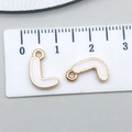 L-shaped gold alloy pendant with white enamel detail and circular loop for DIY jewelry - Letter L