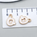 White enamel alloy letter charm with gold base and 10mm measurement scale - Letter Q
