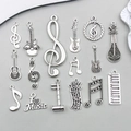 Antiksilberne Musikanhänger-Set mit Gitarre und Noten für DIY-Schmuckherstellung - Gemischt 16 Stück Antiksilber Musikserie