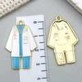 Doctor uniform enamel charm in blue and white colors with golden metallic edge - Blue Enamel Lab Coat