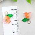 Macro detail of acrylic lily of the valley flower pendant with scale measuring 1.5cm - Orange Pink (22370)