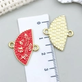 Detailed macro of a 21mm fan pendant showing red enamel finish and grid texture - Red Enamel Good Fortune Fan (21502)