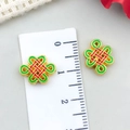 Detailed macro view showing a 1.5cm red enamel Chinese knot pendant for DIY jewelry making - Small Chinese Knot Spacer Bead (22840) / 1 Piece (14x10mm) / Bright Gold