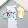 Blue enamel nurse hat charms made of zinc alloy with metric scale for size reference - Blue Nurse Hat Style (23054) / 25x18mm