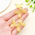 Translucent yellow resin balloon dog charms for DIY jewelry making with metal rings - Glitter Yellow
