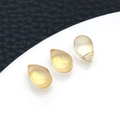 Three yellow teardrop-shaped glass pendants on luxury black and white background - Yellow
