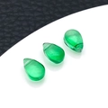 Three emerald green glass teardrop pendants for DIY jewelry making on white surface - Dark Green