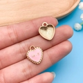 Detail of pink enamel heart charm with Love engraving and golden sunray pattern - Pink White Enamel (10980)