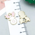 Pink and white enamel Christmas elk alloy pendant showing front and gold back texture - Pink Enamel Elk Style (24980)