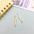 Golden feather pendants with detailed texture and rings for jewelry making - Feather Style B (11633)
