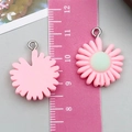 Detail of pink resin flower pendants showing front and back with ruler measurement - Pink Resin Little Daisy Style