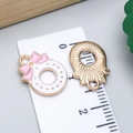 Pink bow and white enamel wreath pendant for DIY jewelry making in a golden finish - Pink Enamel Christmas Bow Wreath