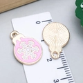 Pink enamel snowflake charms with golden alloy edges and back texture detail - Pink Enamel Round Snowflake