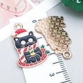Christmas black cat enamel pendant with festive red hat and golden textured back - Black Enamel Candle Scarf Cat (25259)