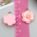 Pink and peach resin flower pendant with silver metal ring measured with a ruler - Pink Resin Plum Blossom Style