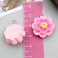 Pink resin flower pendant for DIY jewelry making shown with a measuring scale - Pink Resin Lotus Style