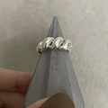 Minimalist silver croissant twist ring on a grey geometric display stand - JZ0428-Twisted Braid