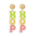 Macro shot of Easter dangle earrings with shiny gold metal studs and HOP glitter letters - Colorful Letter Style (HOP)