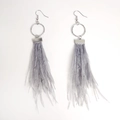 Detail of bohemian long grey feather earrings with textured metal ring and ear hook design - Gray