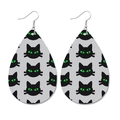 Faux leather teardrop earrings featuring a black cat print with bright neon green eyes - Black Cat Style