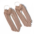 Detailed view of handmade bohemian fringe earrings with beige cotton weaving and long tassels - Beige