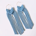 Handmade light blue bohemian woven tassel earrings with gold hoop on white background - Light Blue