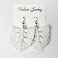 Close-up of white handmade bohemian tassel earrings with woven leaf pattern and silver hooks - 小号白色款式 (S1)