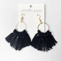 Detail of handmade black tassel earrings with golden metal hooks on a display card - Black