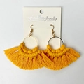 Detail of handmade bright yellow fringe earrings with golden hoop on display card - Bright yellow