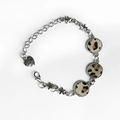 Detail of leopard print leather bracelet with star charms and heart-shaped pendant - Dark Leopard Print (5)