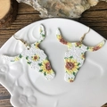 Detail of longhorn steer earrings with vibrant sunflower pattern on white glitter finish - Longhorn Bull Head Sunflower-White Glitter (4)