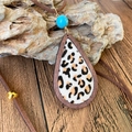 Close-up of leopard print teardrop pendant with wood frame and turquoise bead - Leopard Print Style (4)
