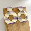Detail of polymer clay earrings with purple and yellow stripes on wooden stand - Lilac Yellow White Striped Style