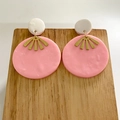 Detail of handmade pink clay earrings with gold metal fan and wooden stand - Geometric Round Dangle Style / Pink