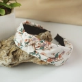 Floral fabric headband with center knot detail resting on natural stone decor - Knot Style / Beige Floral (2)