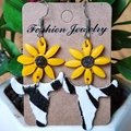 Detail of sunflower and zebra print cow head earrings on a jewelry display card - Sunflower Zebra Pattern Bull Head Style (1)