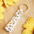 Genuine leather keychain with golden polka dots and metal ring on wooden background - White Gold Dot Style (4840119135407)