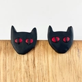 Detailed view of handmade black cat earrings with red eyes for Halloween jewelry styling - Black Cat (1)