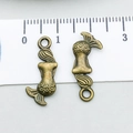 Detail view of two antique bronze mermaid charms with measuring ruler for size reference - Mermaid (8214)