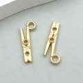 Detailed view of polished KC gold alloy clothespin pendants with unique triple hole design - 1 Piece KC Gold Clip Shape (20253)