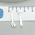 Detail view of mini silver wrench charms for DIY jewelry with a measurement scale - 1pc Bright Silver Wrench 23*6mm (0.5g) (20402)