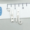 Macro view of two 2cm silver alloy clothespin charms measured against a white ruler - 1pc Bright Silver Clip 7*18mm (0.5g) (20218)